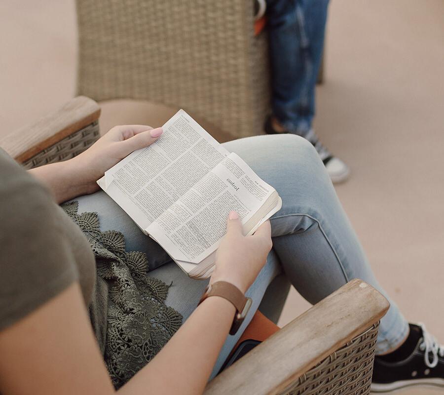 A biblical studies major reading a Bible